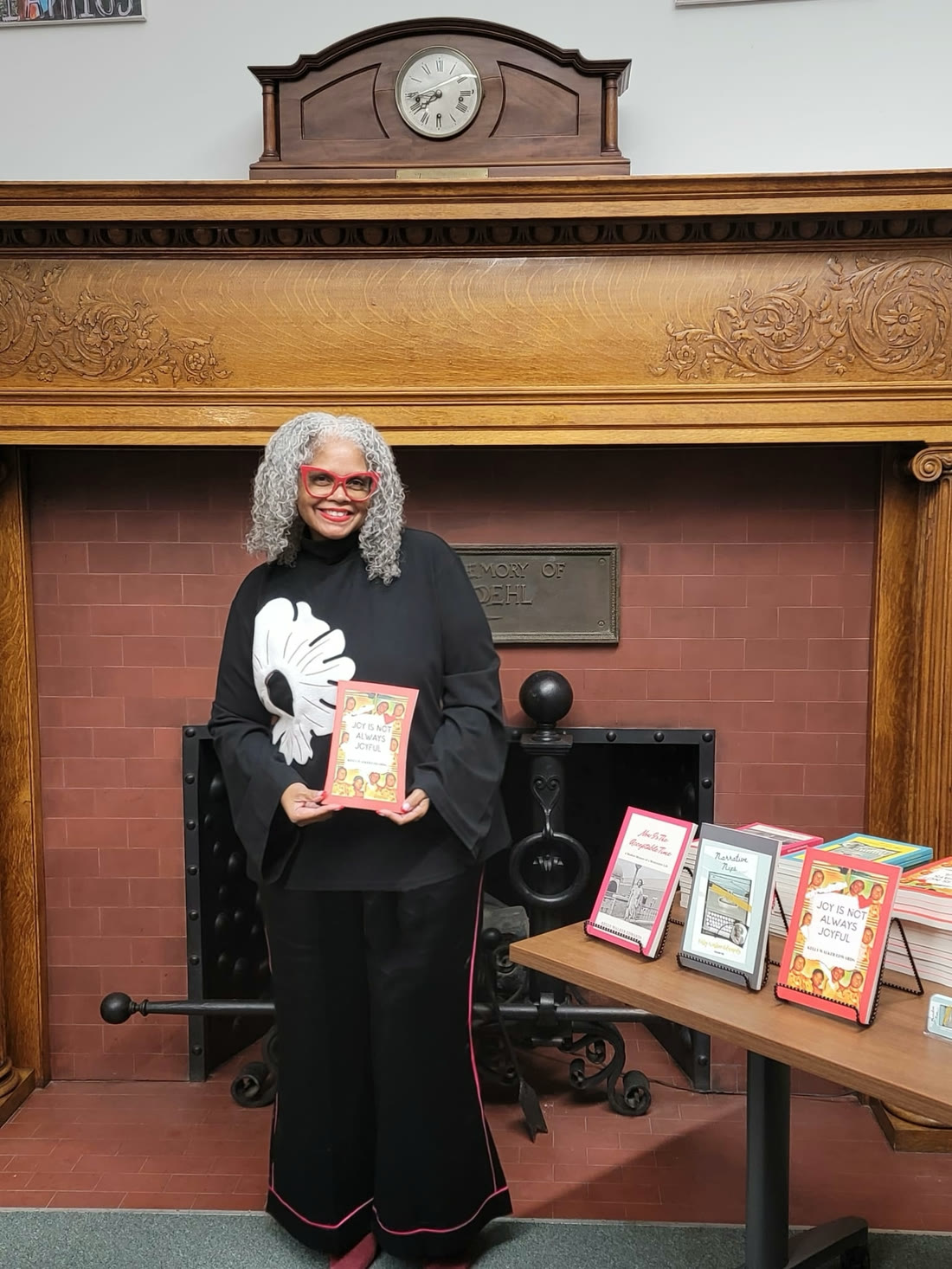 Kelly Walker Edwards with her books at an author table